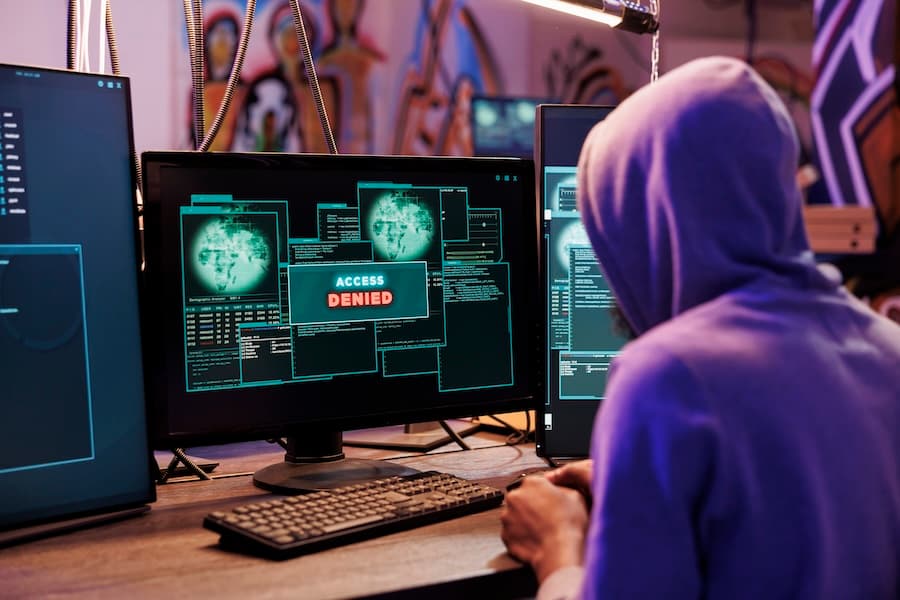 Cybersecurity specialists analyzing digital threat data on screen, showcasing our advanced ransomware mitigation services. Cybersecurity specialists analyzing digital threat data on screen, showcasing our advanced ransomware mitigation services.