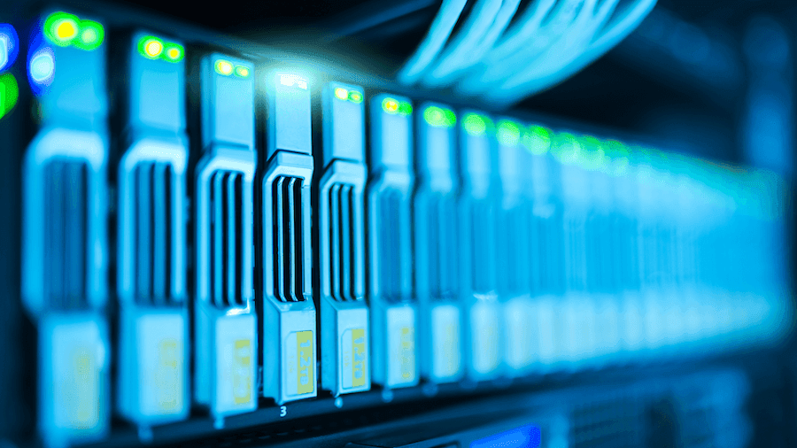 Close-up of illuminated blue server rack in a dimly lit data center. Rows of sleek, modern hardware emphasize advanced technology and connectivity. Close-up of illuminated blue server rack in a dimly lit data center. Rows of sleek, modern hardware emphasize advanced technology and connectivity.